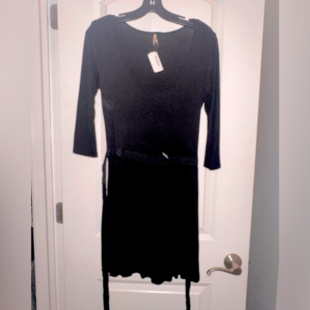 Beautiful long 3/4 sleeve black Neiman Marcus belted dress.